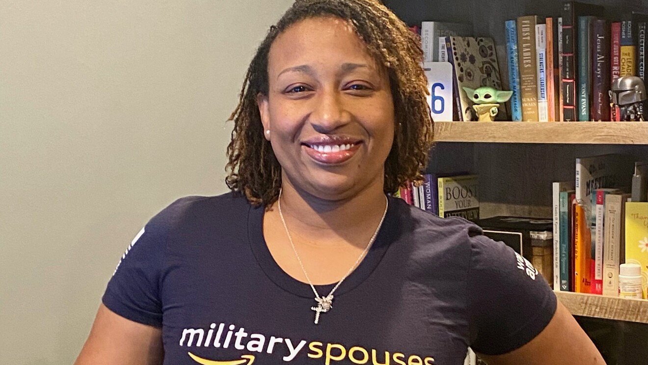 An Amazon employee smiles at the camera