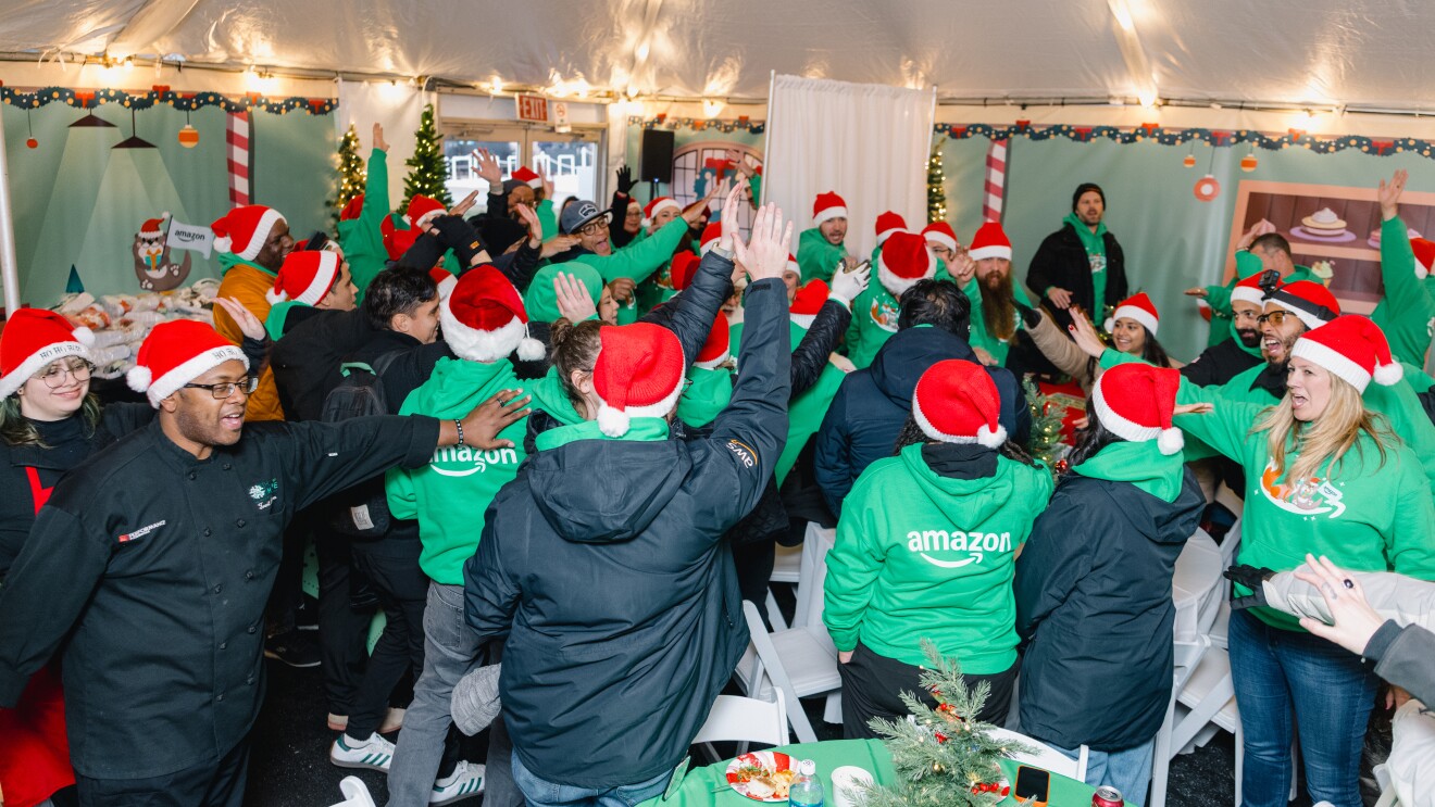 Amazon employees celebrating at festive Christmas party