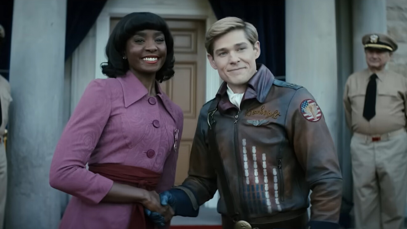 Mason Dye as Bombsight shaking hands with a women in a pink suit in Prime Video's Vought Rising