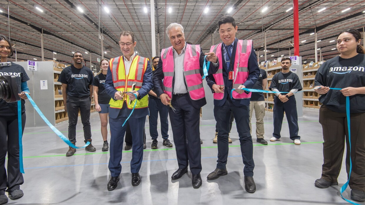 Wayne Angus, director of operations, Amazon Australia, joined by Fairfield City Council Mayor Frank Carbone and Councillor Kevin Lam at a ribbon cutting