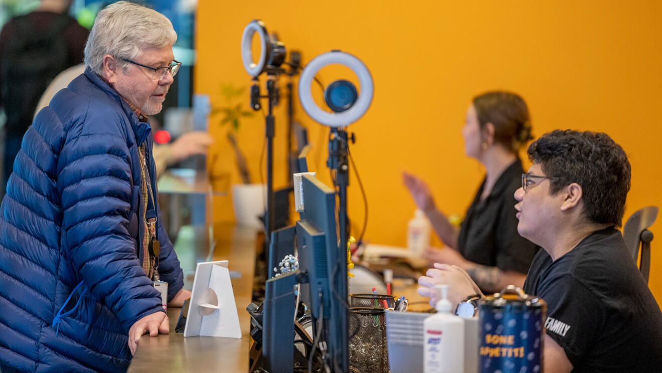 Two employees gathered in the reception area of Amazon's Seattle offices.