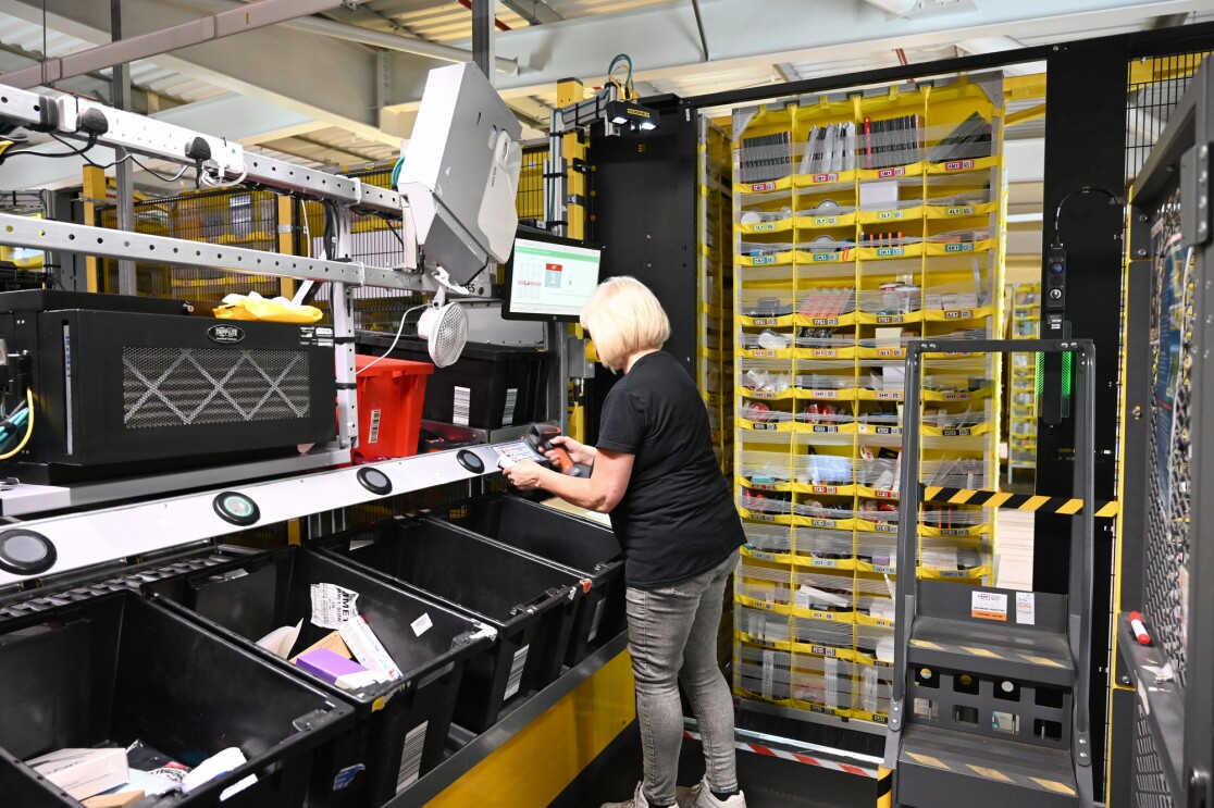 An employee scanning items at BRS1