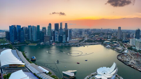 An image of Singapore's central business district at sunset