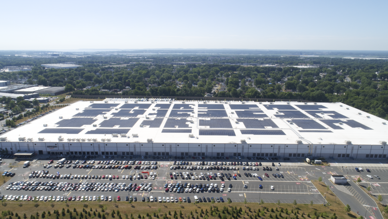 Aerial view of an Amazon facility with solar panels in New Jersey
