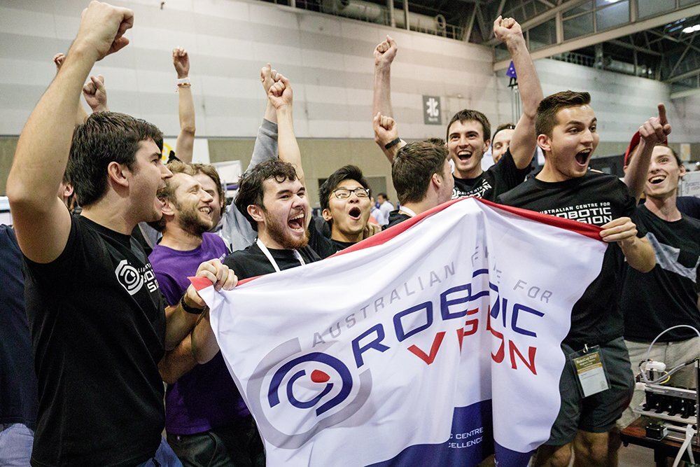 A group of Australian students cheer after winning the Amazon Robotics Challenge.
