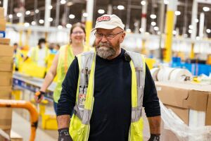 Amazon employees working in a fulfillment center
