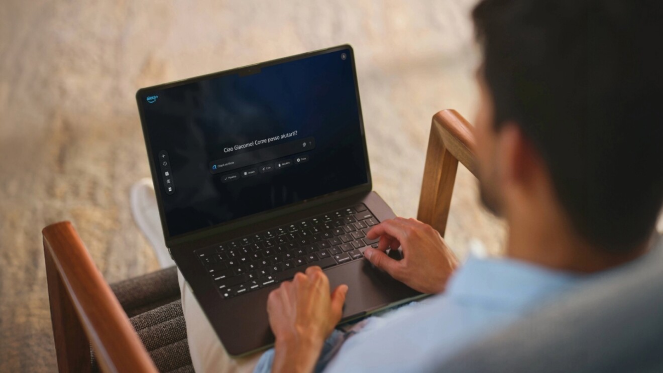 Man using Alexa+ on his laptop whilst sitting on a chair