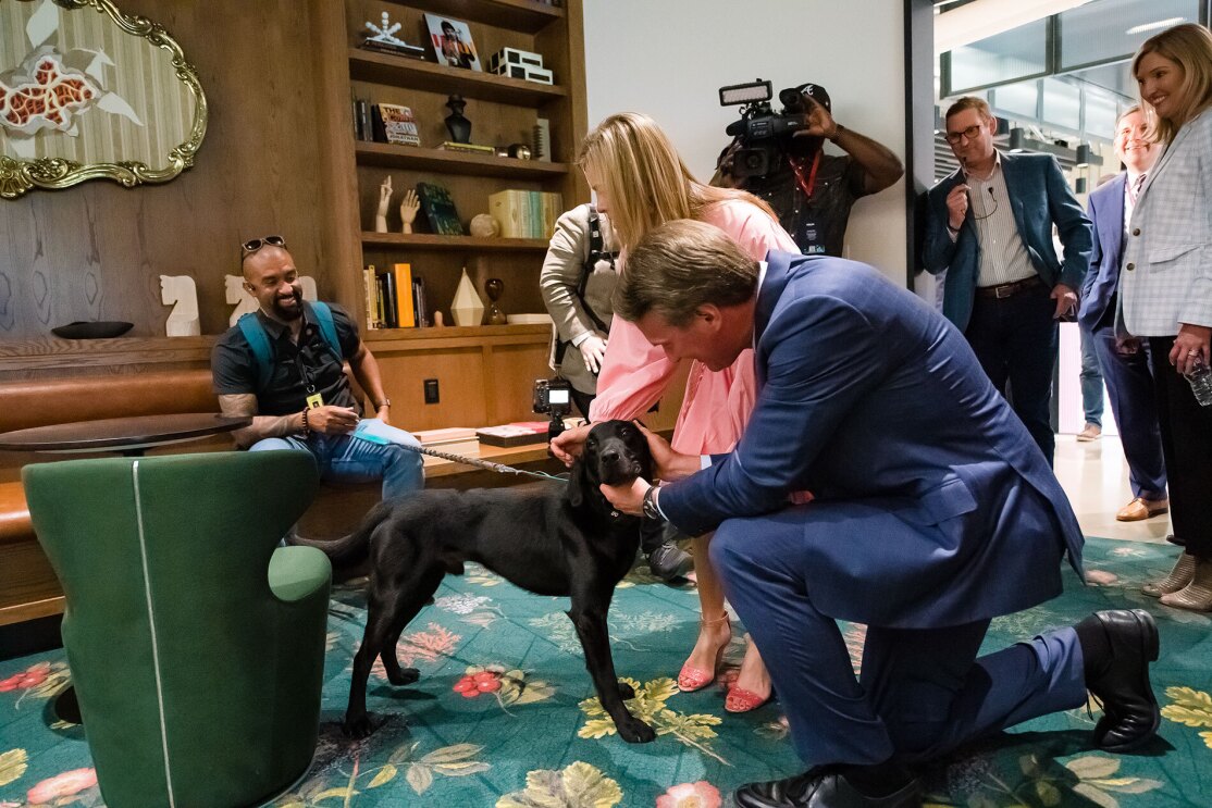 An image of local officials touring Amazon's second headquarters on its opening day