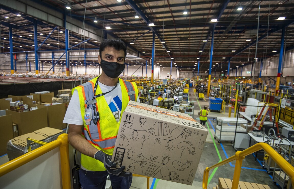 Amazon Warehouse Associates working at the Amazon Fulfilment Centre BWU1