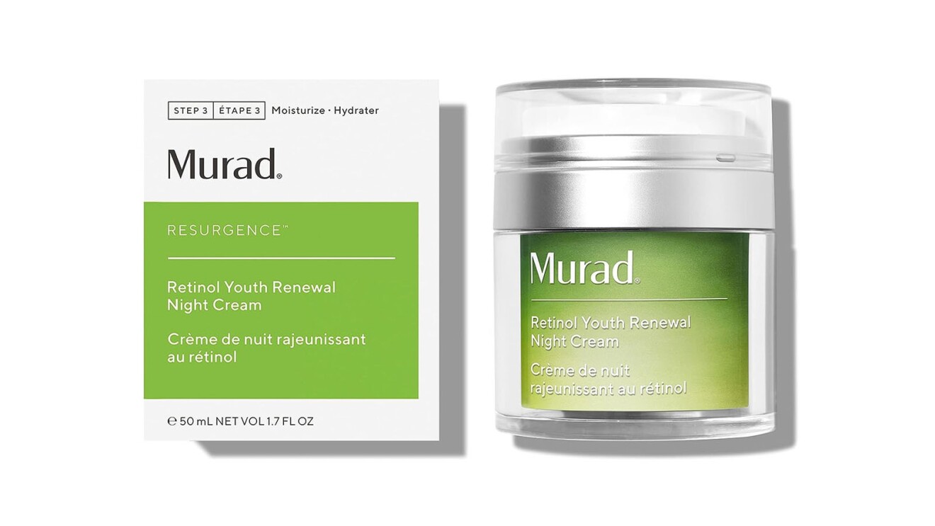 An image of a small, green container with a silver lid that says "Murad" on the front. There is a box next to the container that the product comes in. The text on the front says it is the youth renewal night retinol cream.