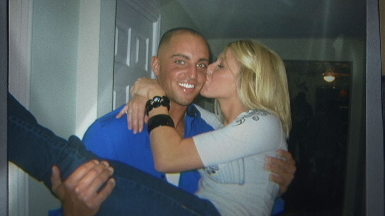 Mallory Horwitz kissing Zach Horwitz on the cheek.