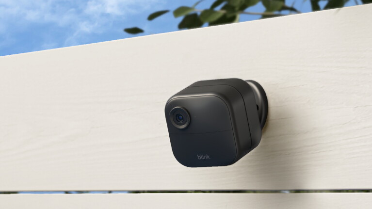 An image of a Blink Outdoor 4 camera mounted on a wall.
