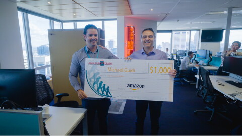 Amazon Stars Michael receiving a cheque