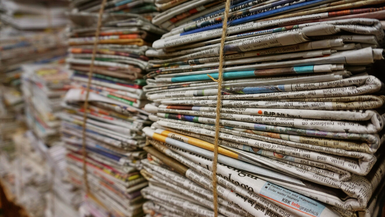 Stacks of newspapers bundled together