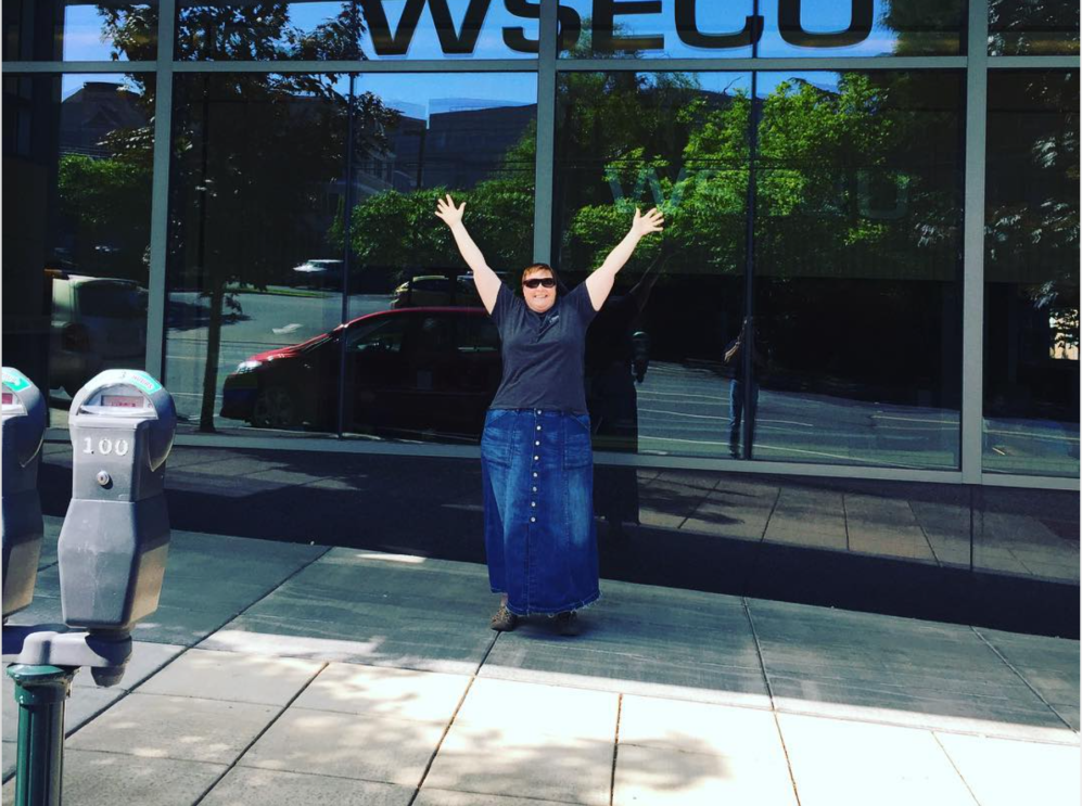 A supporter of the body positive movement smiles for a photo.