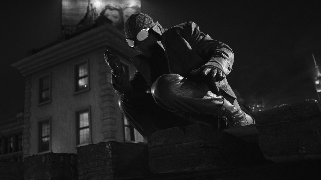 Spider-Noir: Night skateboarding action shot capturing mid-air trick in black and white