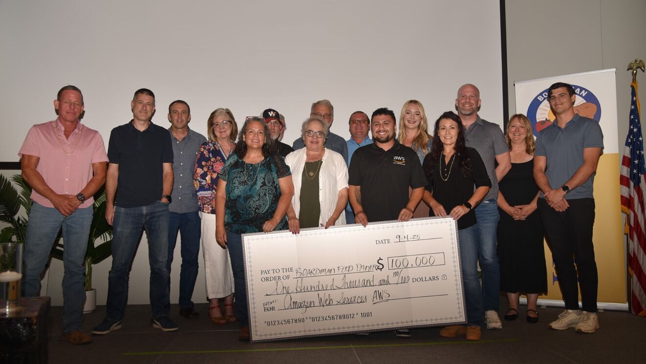 Group photo with large $100,000 check presented to the Boardman Food Pantry