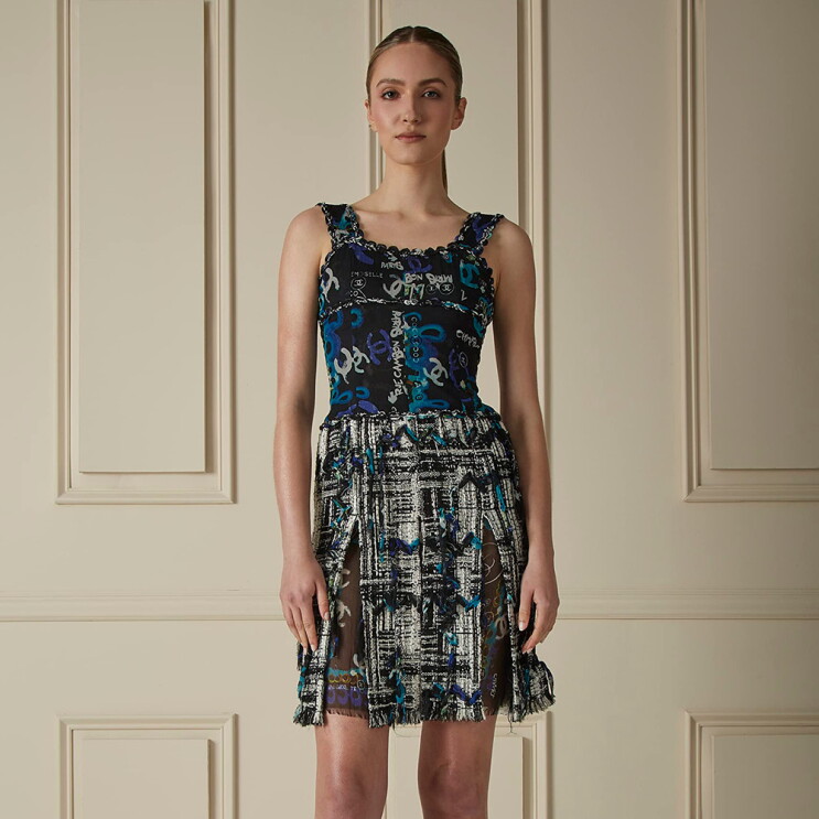 Models wearing clothing and purses from the What Goes Around Comes Around capsule collection.