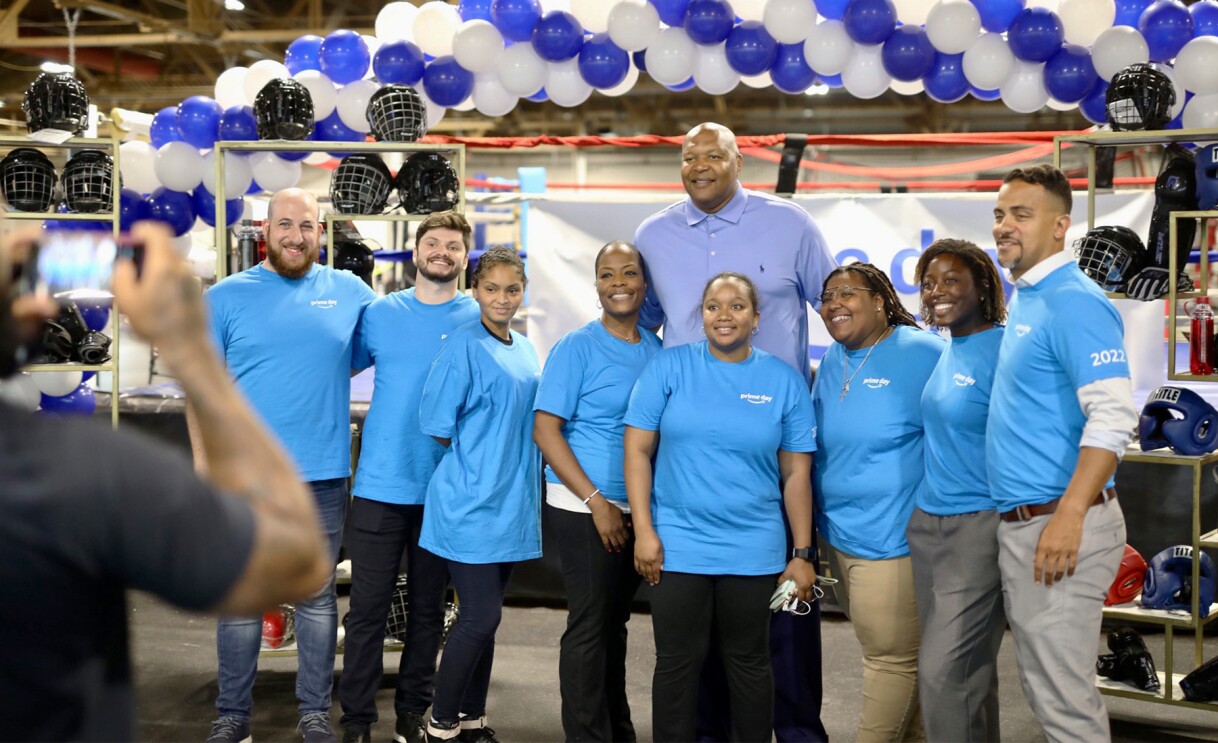 Amazon employees surprise nonprofits and schools with donations of various items.