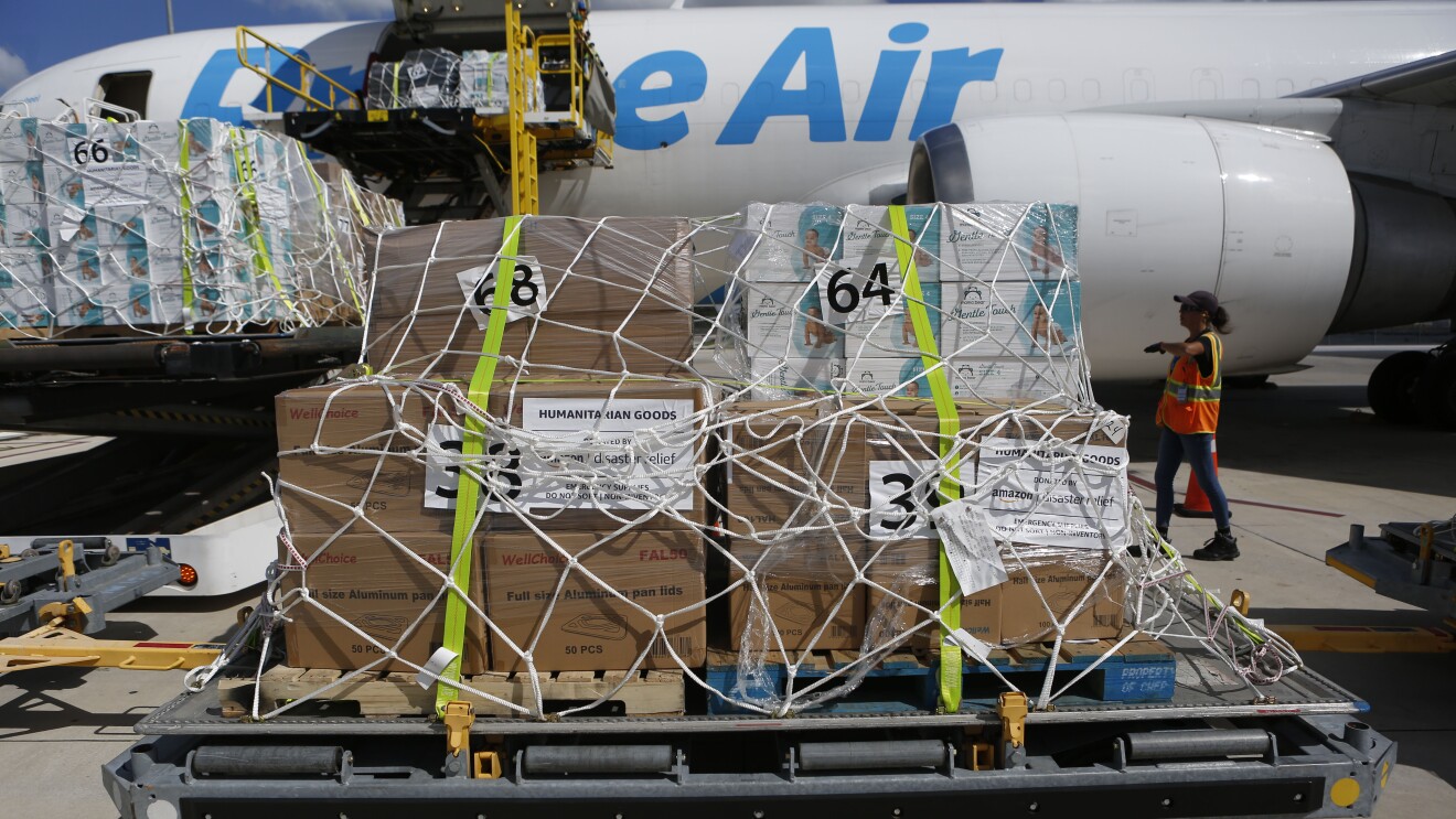 Humanitarian aid packages being unloaded from Prime Air cargo plane by DRbA for Hurricane Milton 