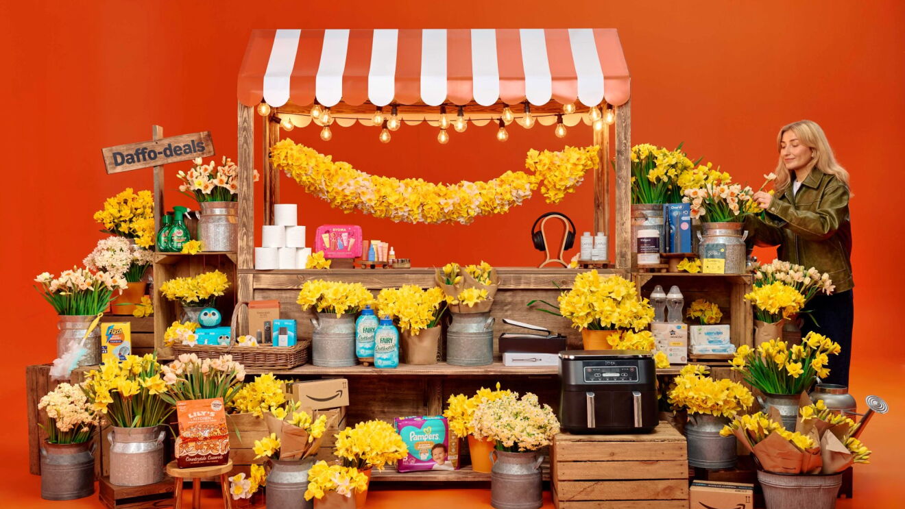 A fair market stall selling yellow flowers