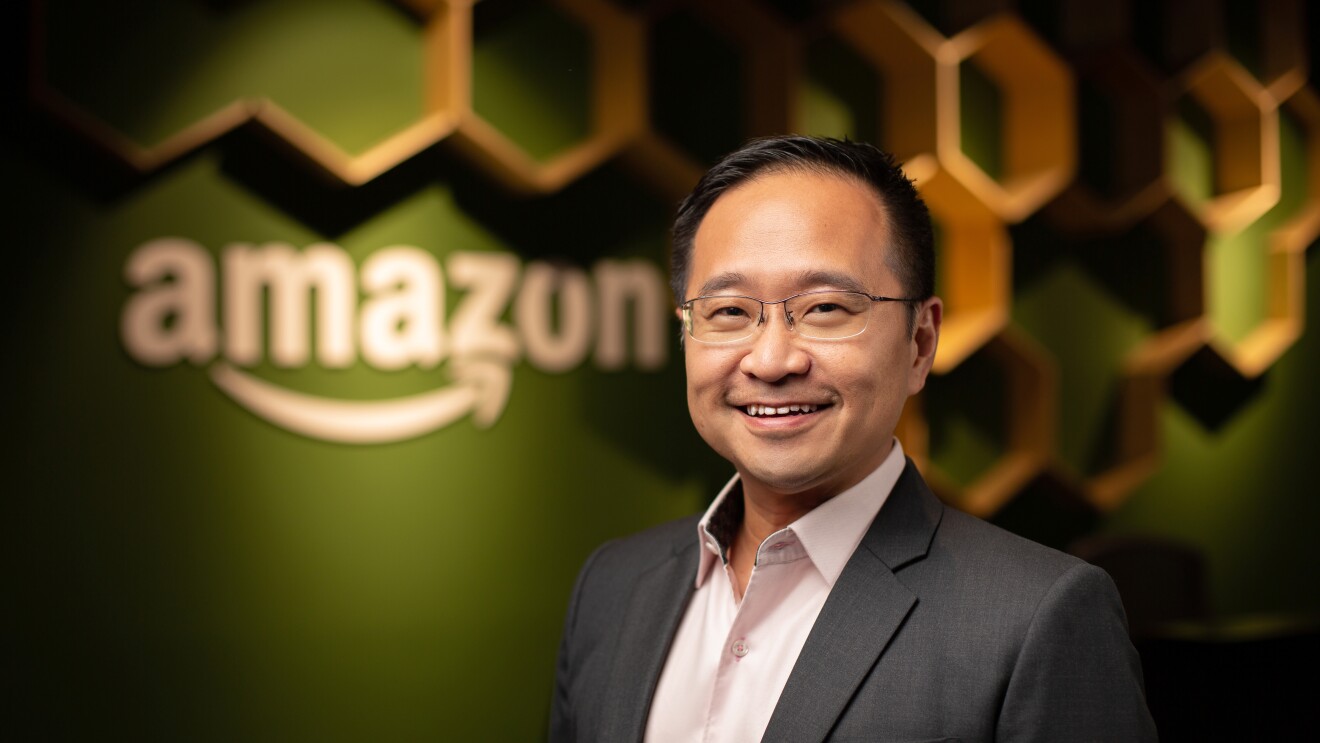 Mr Henry Low, Country Manager at Amazon Singapore, against a backdrop of the Singapore office