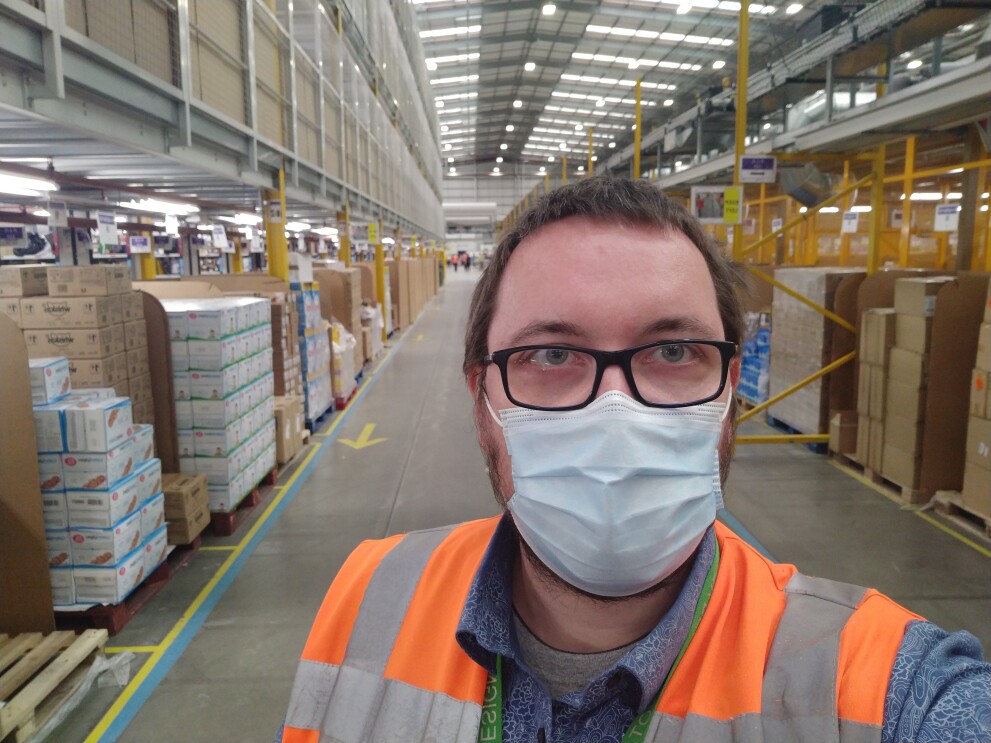 Employee wearing mask at Amazon fulfilment centre