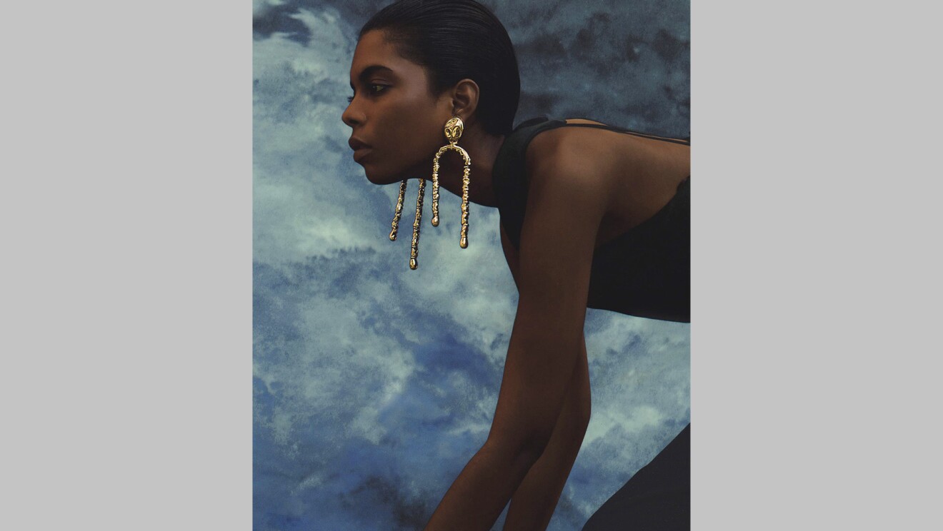 An image of a model wearing earrings by sordo. 