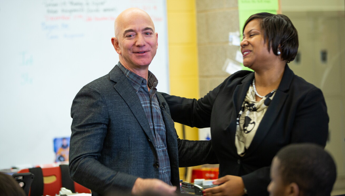 Amazon employee volunteers work on coding projects with students at Dunbar High School in Washington, DC to celebrate Amazon Future Engineer's 2,000 high schools milestone.