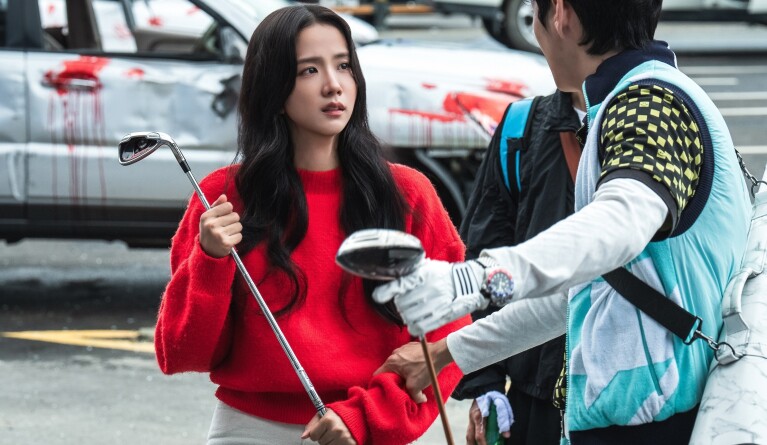 K-dramas on Prime Video: Woman in red sweater holding golf club faces man with golf equipment