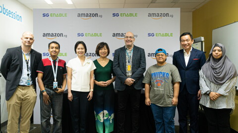 Group photo with Associates with Disabilities and Amazon Singapore, against a backdrop with Amazon.sg logo and SG Enable 