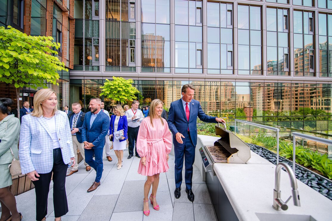 An image of local officials touring Amazon's second headquarters on its opening day