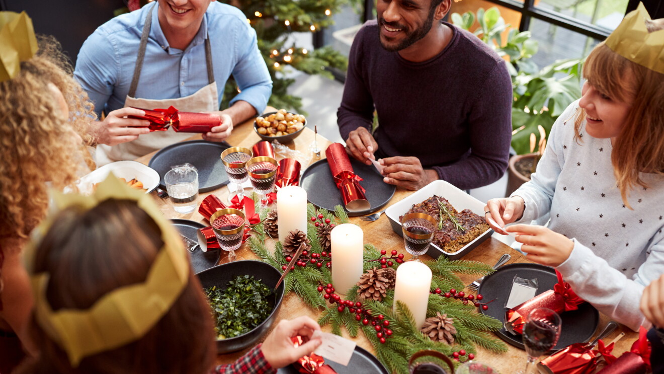 Christmas Lunch with friends reading jokes from crackers