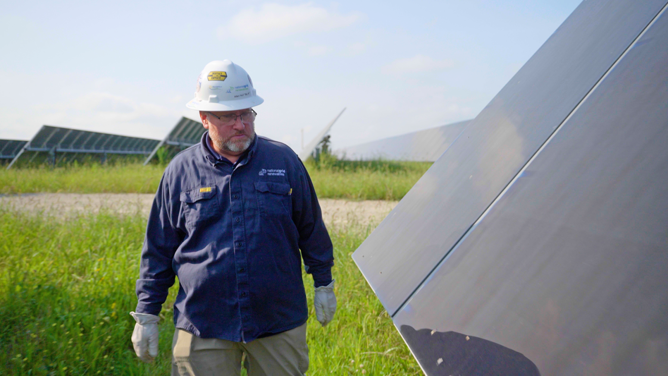 A photo of Allen Hull, solar plant manager, walking through the Amazon Solar Farm Ohio–Yellowbud.