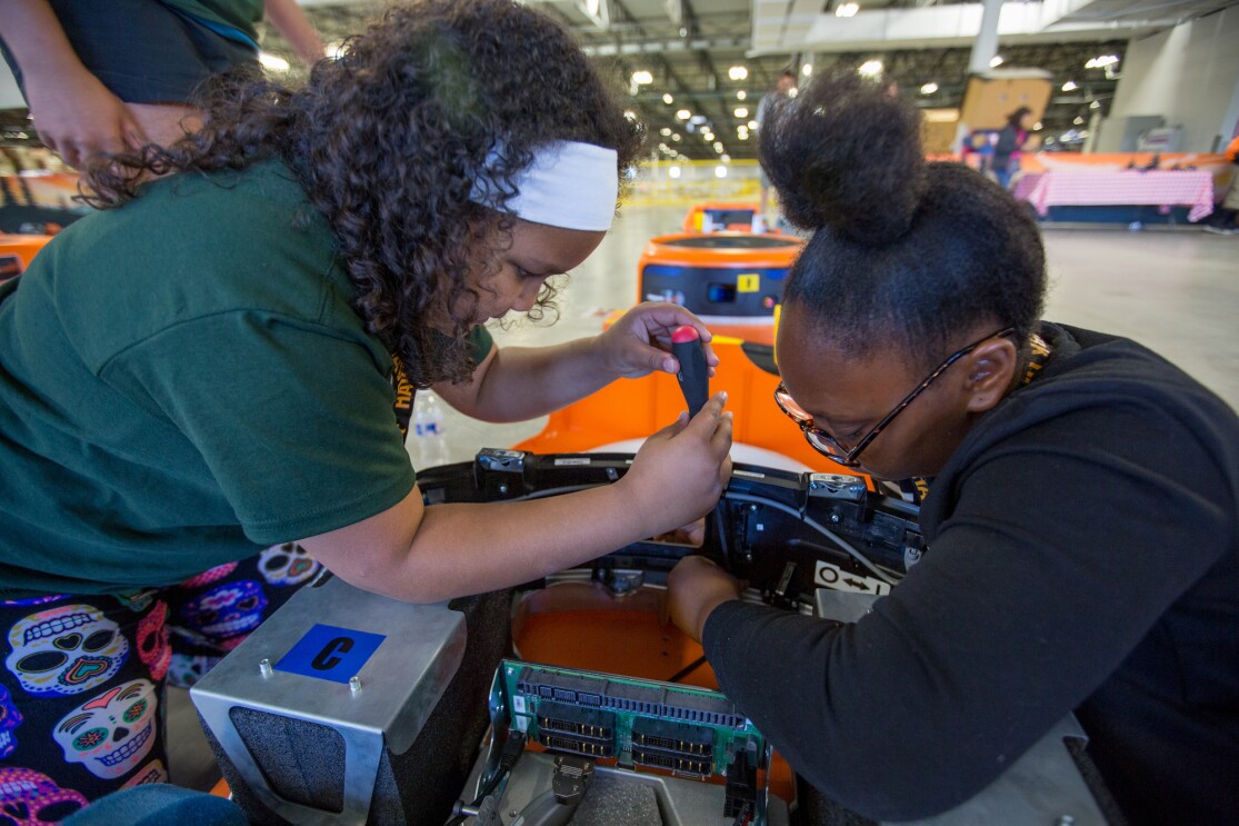 Students participate in a Camp Amazon event at a fulfillment center in Washington