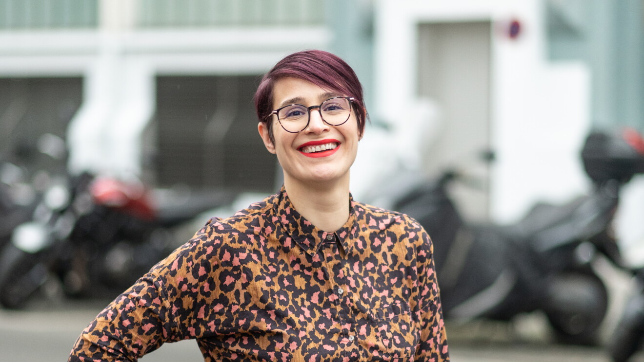 Sandra smiling in the street