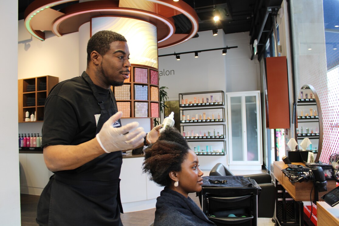Stylist Korell explaining next step to the client
