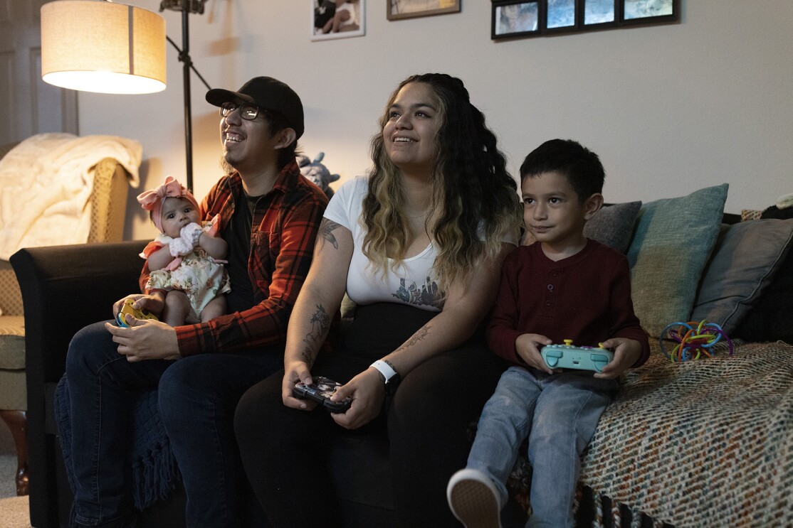 Amazon employees Brisa and Victor who received paid parental leave support from the company when they had their child 