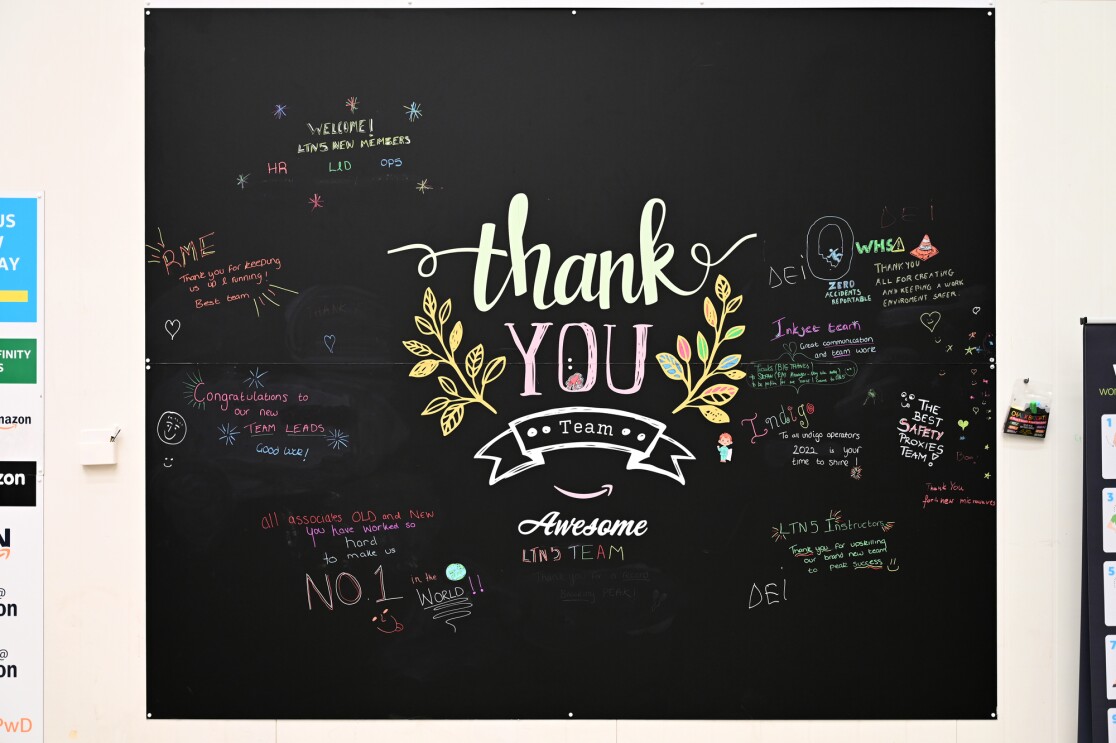 A blackboard with friendly, welcoming messages written by staff.