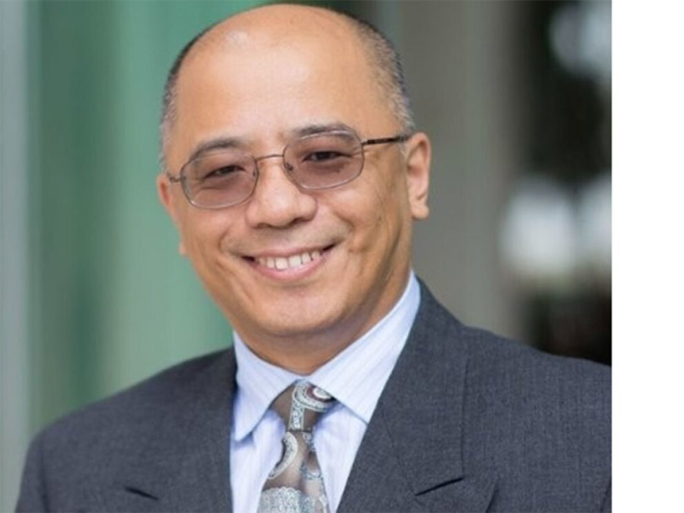 Crop shot of Tommy Jiang in a suit and tie