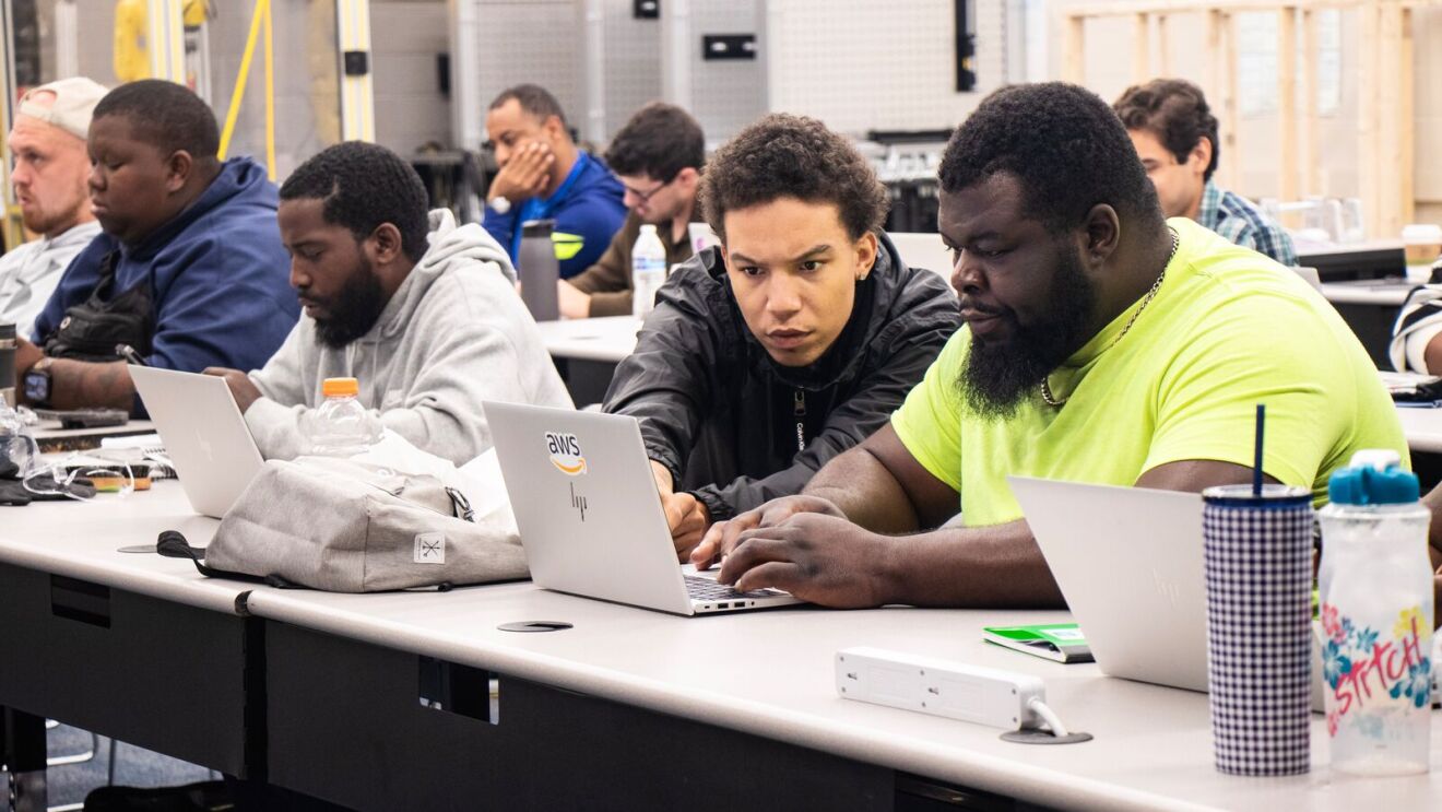 AWS training in Columbus OH: individuals in training on laptops