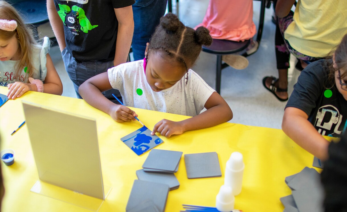 Amazon employees surprise nonprofits and schools with donations of various items.