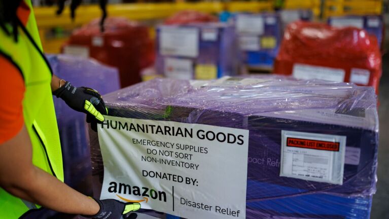 Humanitarian goods box labeled as Amazon Disaster Relief donation