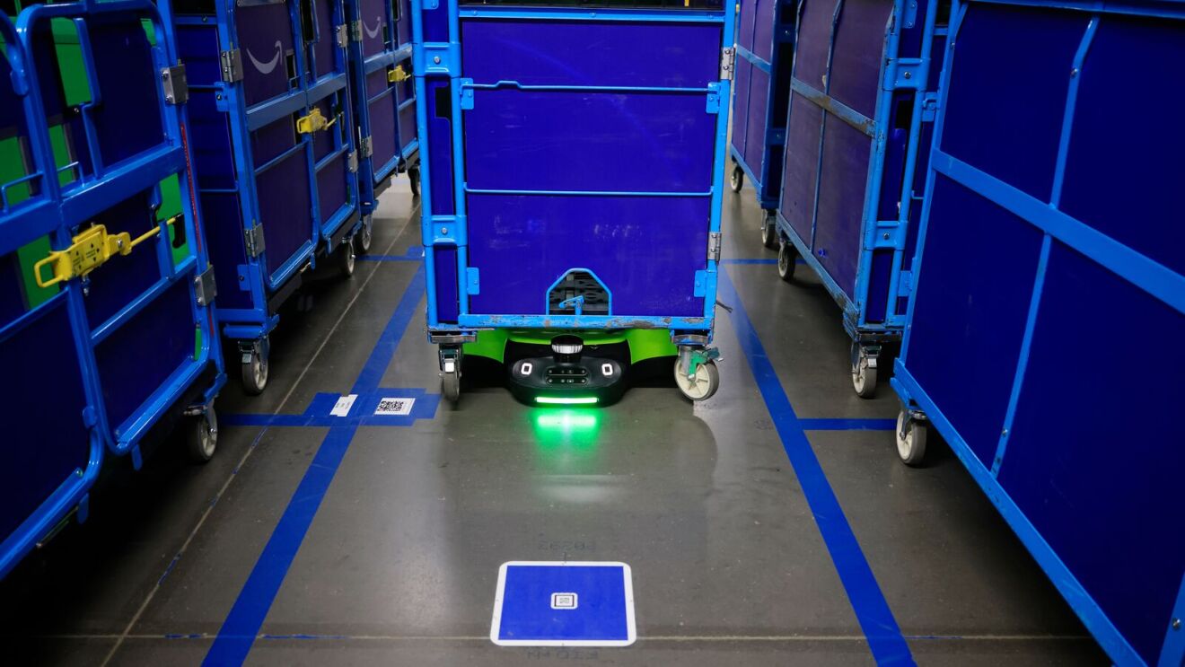 An Amazon robot transporting a cart