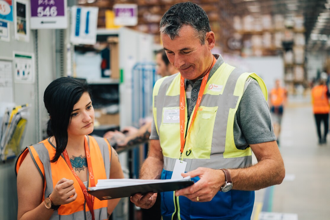 John Sheerin reviewing some health and safety procedure with an Amazon associate