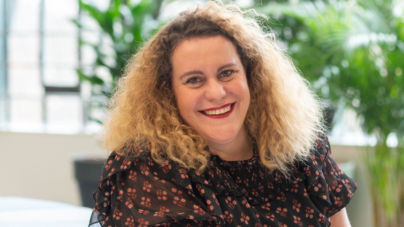 Delphine sitting in office workspace