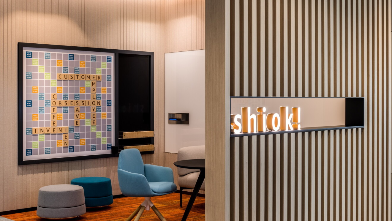 A Scrabble game on a wall with the word Shiok! 