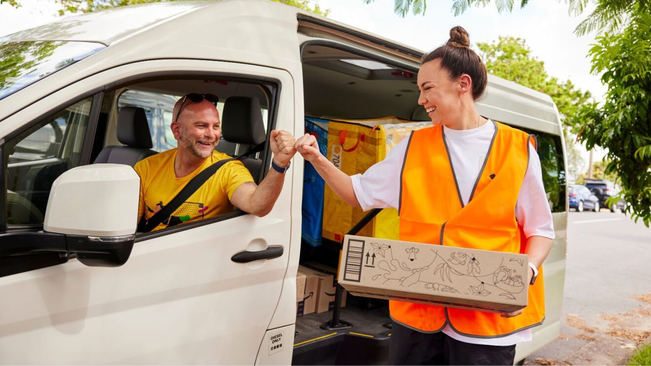 Mackenzie Arnold fistbumps Amazon Flex driver Phil Rock.