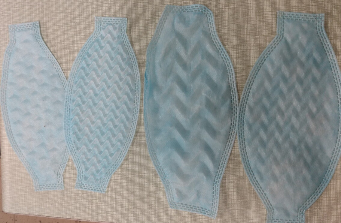 Four different mask prototypes lay side-by-side.