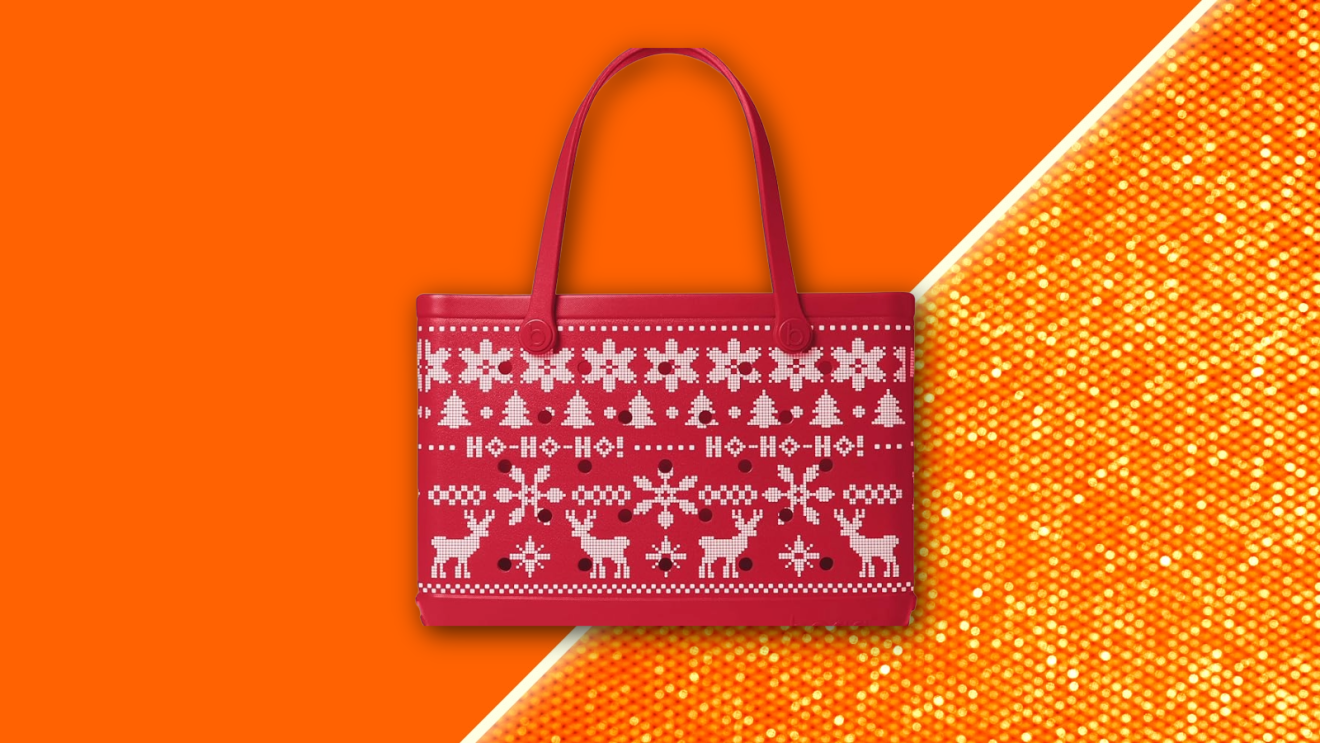 Bogg Bag floating against a vibrant orange backdrop. 